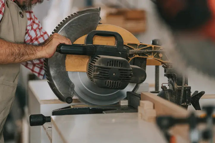 miter saw cutting lumber door frame components