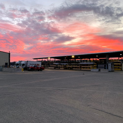 A vibrant red and pink sky over a parking lot in East Brookfield, MA
